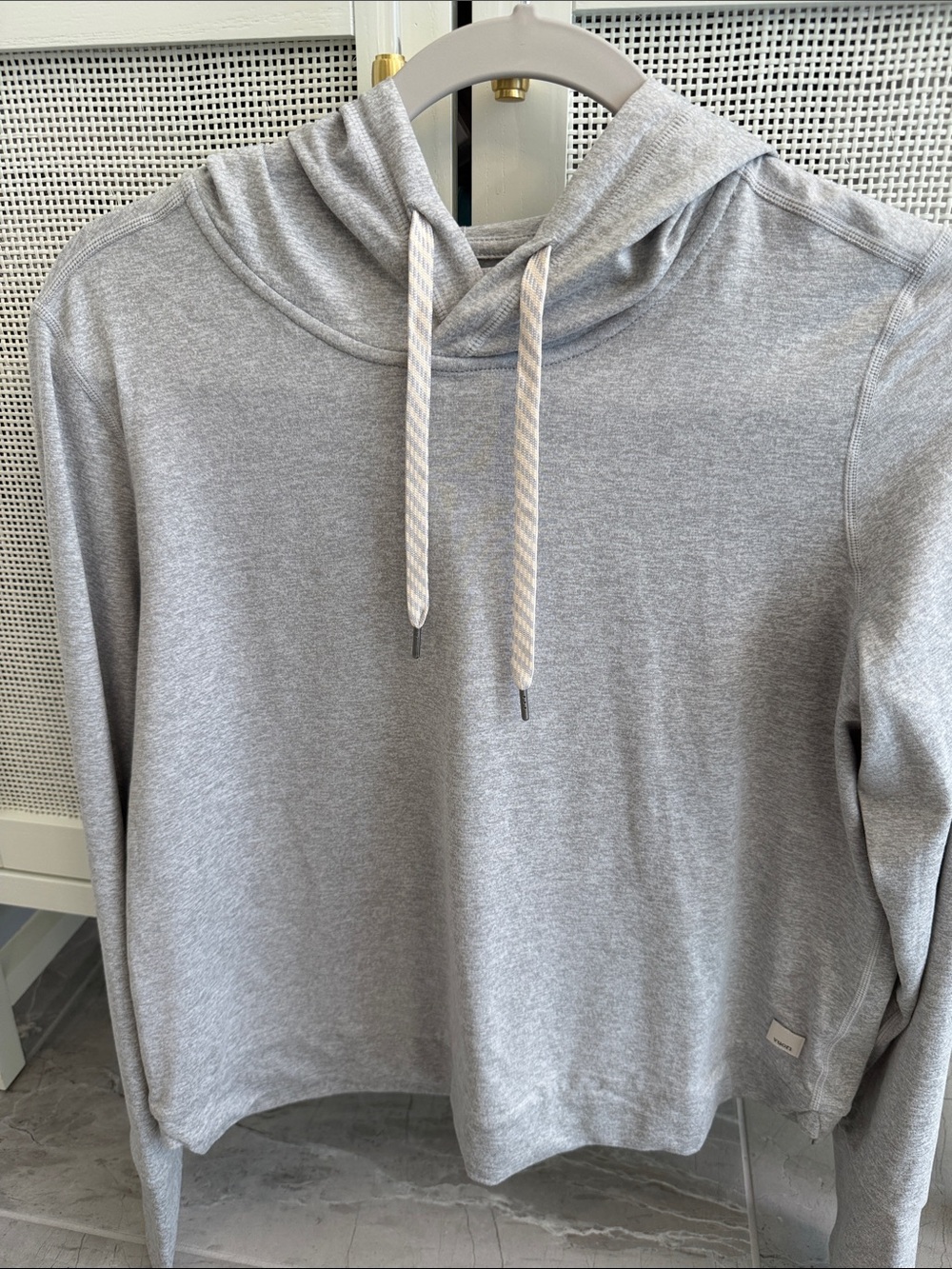 Women’s Vuori halo hooded sweatshirt in light grey heather.
